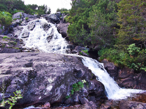 Cascades on the Murgbach stream in the Alpine Valley of Murgbachtal - Canton of St. Gallen, Switzerland photo