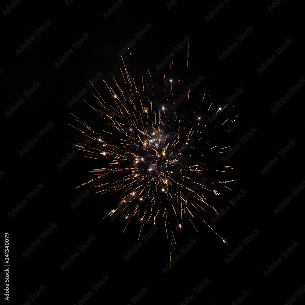 Yellow orange firework against night sky close up Yellow orange firework against night sky close up