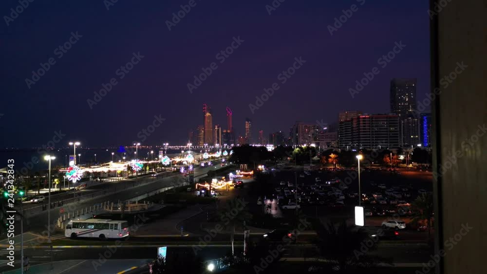 Beautiful view of Abu Dhabi city skyline and famous corniche street at night Beautiful view of Abu Dhabi city skyline and famous corniche street at night