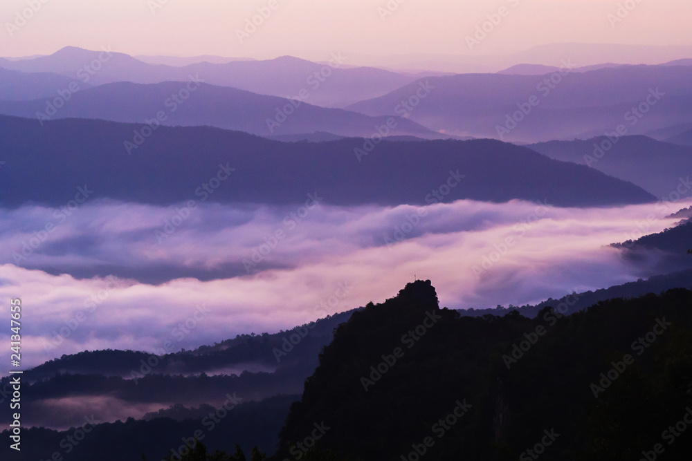 sunset overlooking mountains with Mist sunset overlooking mountains with Mist