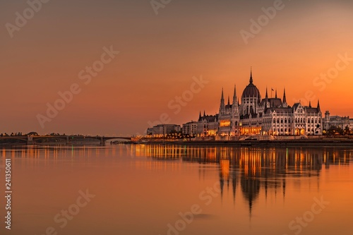 Sunrise with Parliament and water reflection in the Danube, Budapest, Hungary, Europe