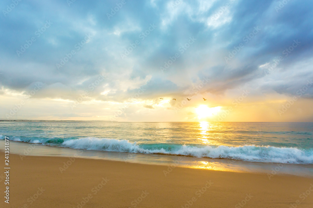 A beautiful Caribbean beach sunset with clean waves crashing. Location Rompeolas (Breakwater) Beach, Aguadilla Puerto Rico.