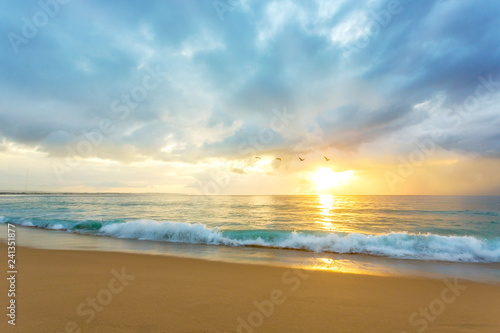 A beautiful Caribbean beach sunset with clean waves crashing. Location Rompeolas (Breakwater) Beach, Aguadilla Puerto Rico.