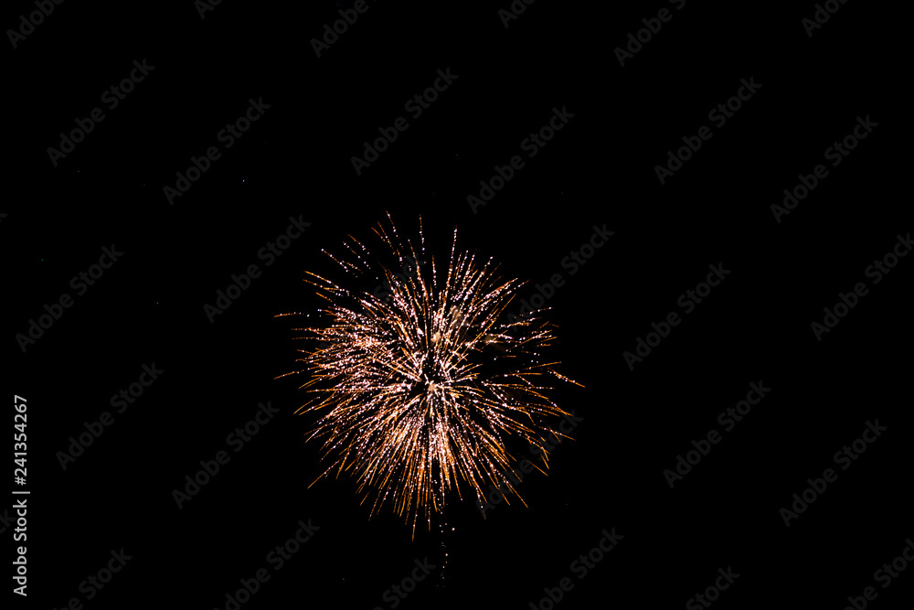 golden fireworks in black background