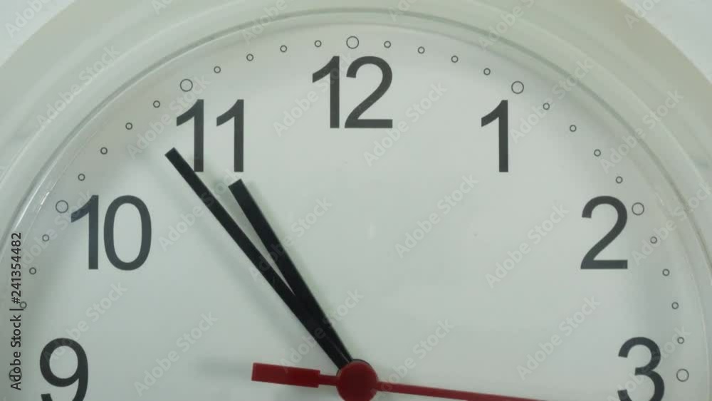 Close-up White clock with Black numbers and arrows on White background, Time Lapse Clock walking 20 minute.