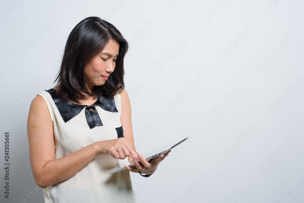 asian working woman portrait on white background. businesswoman working with tablet, business concept, smart girl use tablet asian working woman portrait on white background. businesswoman working with tablet, business concept, smart girl use tablet
