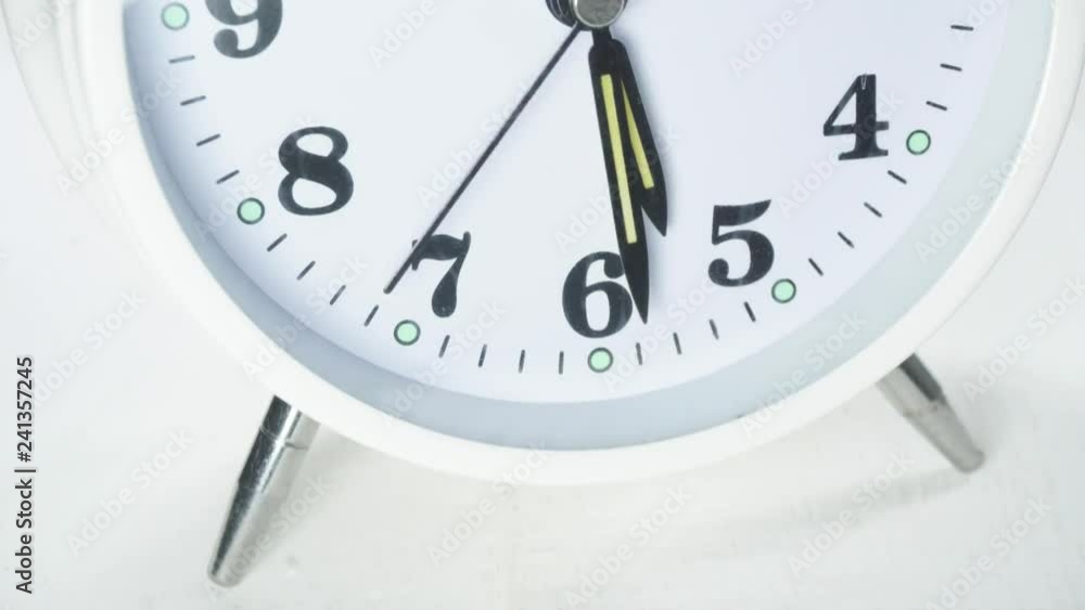 Five o'clock in the morning, get up and wake up to work. Close-up alarm clock on White background, Time Lapse Clock walking 20 minute. Five o'clock in the morning, get up and wake up to work. Close-up alarm clock on White background, Time Lapse Clock walking 20 minute.