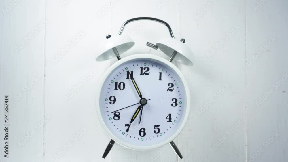 Rush hour get up and wake up to work, white alarm clock on white background, Time Lapse Clock walking 30 minute. Rush hour get up and wake up to work, white alarm clock on white background, Time Lapse Clock walking 30 minute.