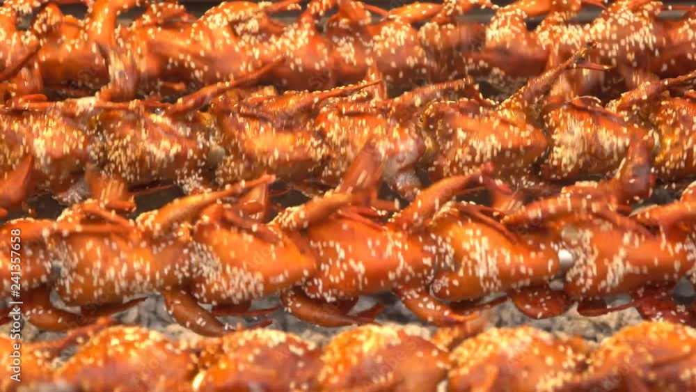 Roasting quails on wheel, close up, street food in Bangkok, Thailand. slow motion. Roasting quails on wheel, close up, street food in Bangkok, Thailand. slow motion.