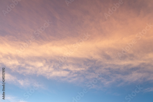 Sunset or sunrise sky with clouds and sunlight. © korkeng