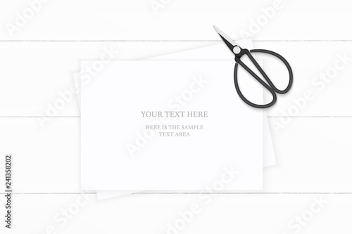 Flat lay top view elegant white composition paper and vintage metal scissors on wooden background