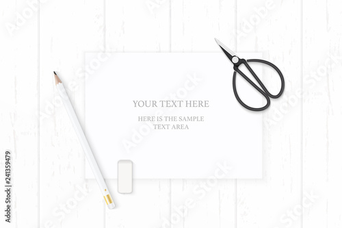 Flat lay top view elegant white composition paper pencil eraser and vintage metal scissors on wooden background
