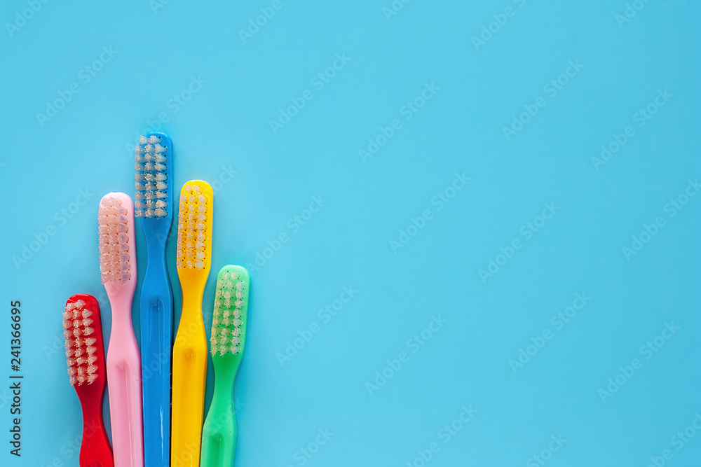 Toothbrush used for cleaning the teeth on blue background for dental care concept Toothbrush used for cleaning the teeth on blue background for dental care concept