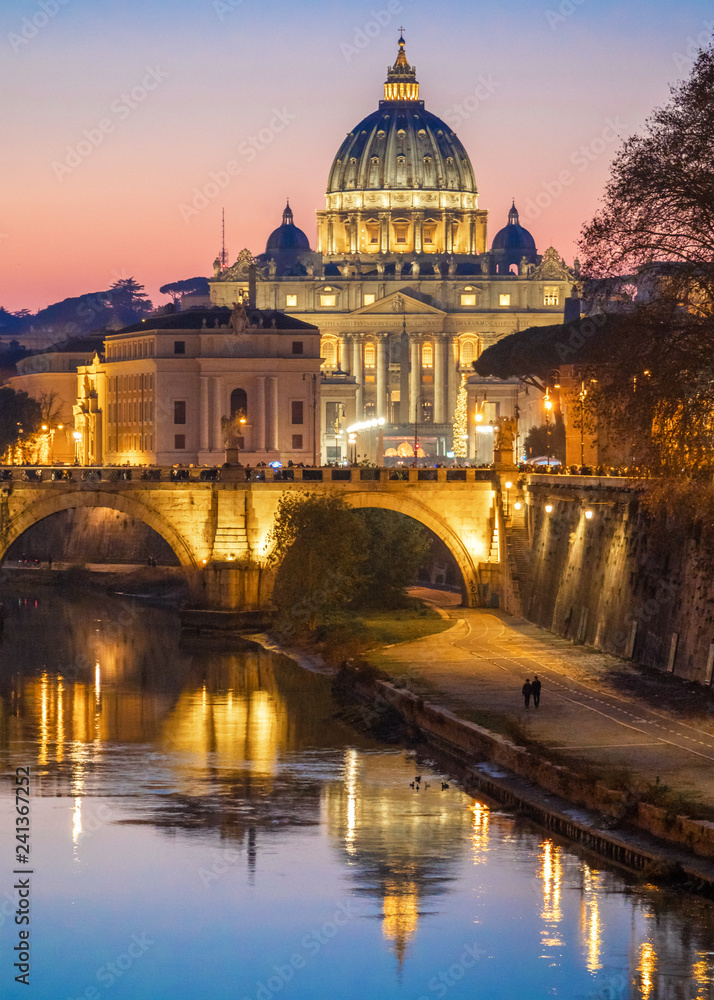 Rome (Italy) - The Tiber river and the monumental Lungotevere at sunset. Here in particular the Saint Peter basilica in Vatican