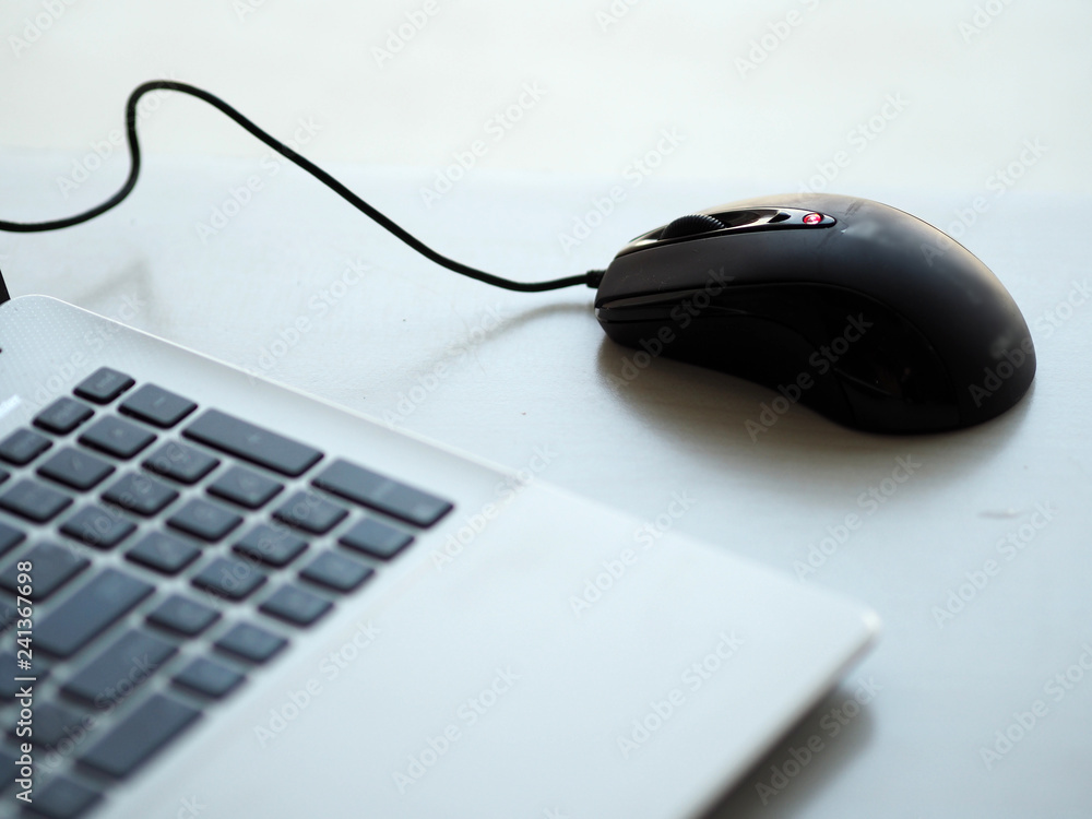 one Notebook and mouse on the desk working one Notebook and mouse on the desk working