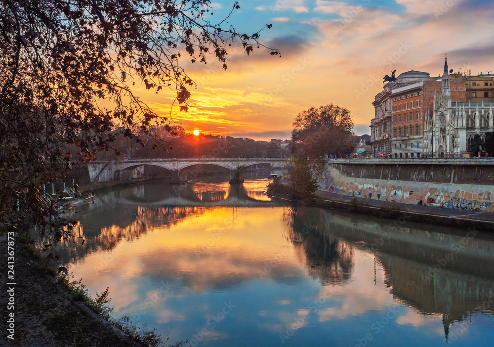 Rome (Italy) - The Tiber river and the monumental Lungotevere at sunset. 