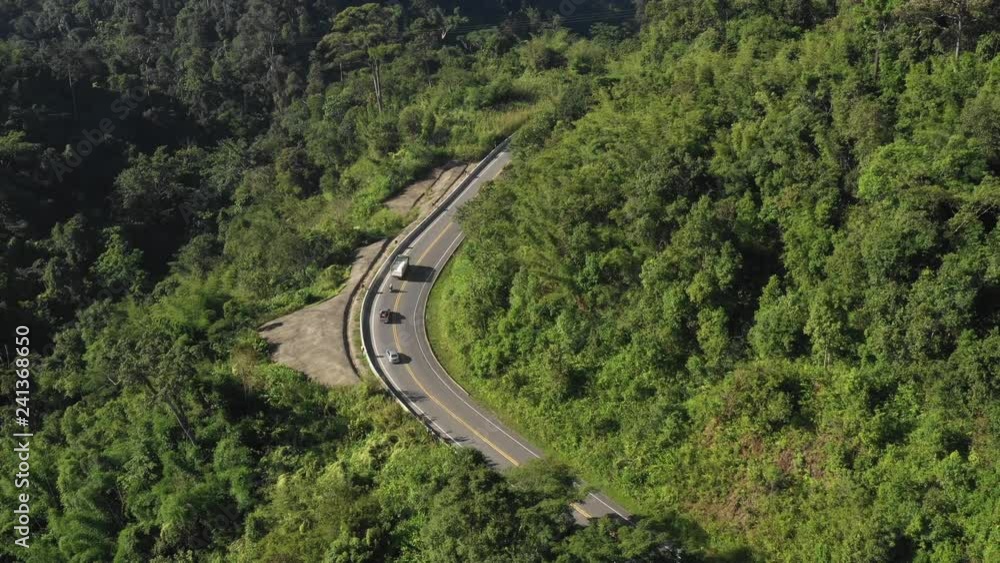 Aerial scene of fly over the road on mountain in day time Aerial scene of fly over the road on mountain in day time