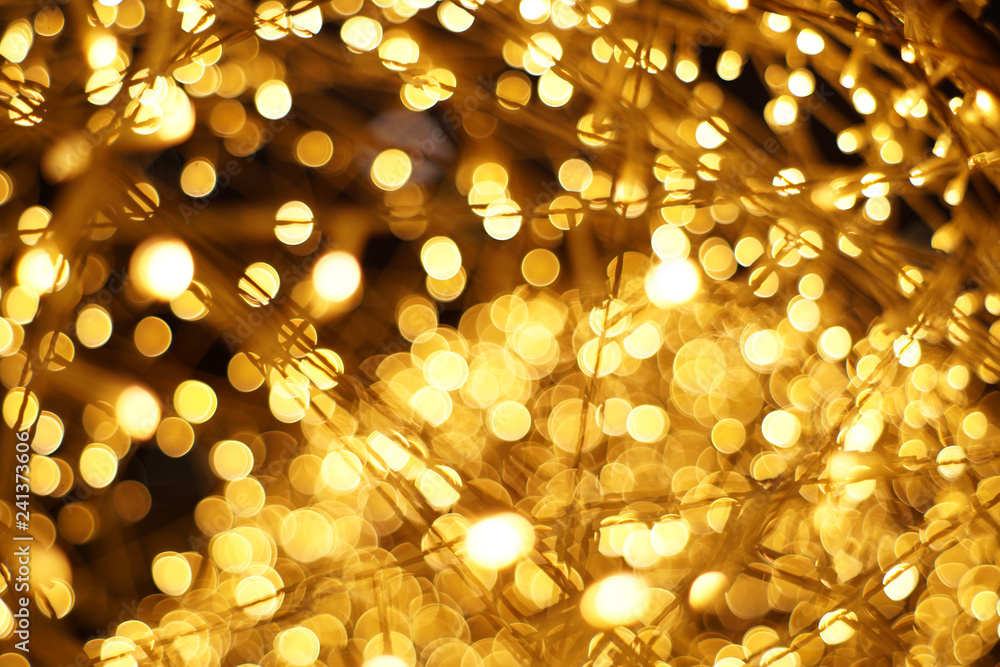 The golden bokeh blurred abstract pattern background. The golden bokeh blurred abstract pattern background.