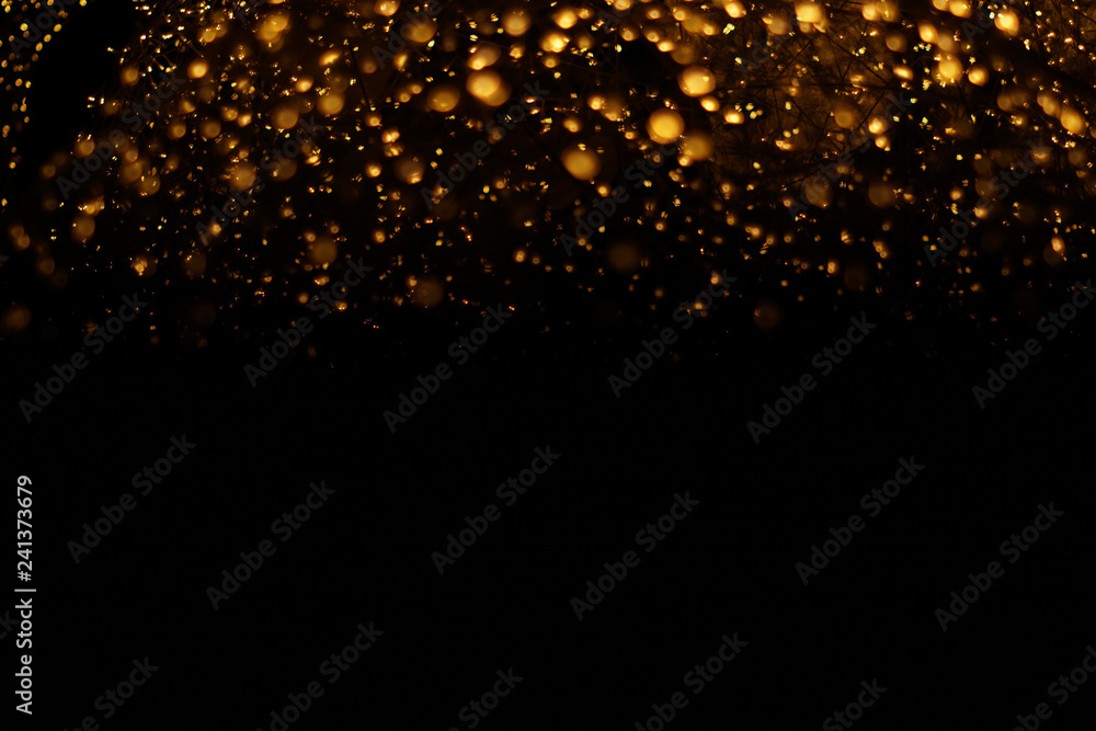 The golden bokeh blurred abstract pattern background. The golden bokeh blurred abstract pattern background.
