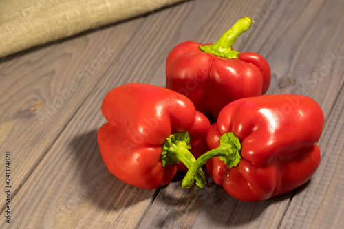 Three sweet red peppers on the table