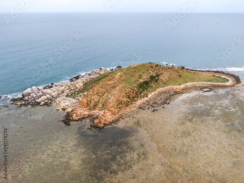 Rocky island in the middle of the ocean
