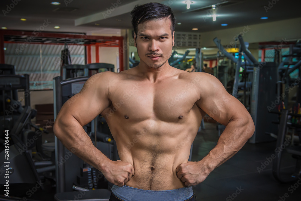 personal fitness trainer show his muscles or Strong bald bodybuilder with six pack personal fitness trainer show his muscles or Strong bald bodybuilder with six pack