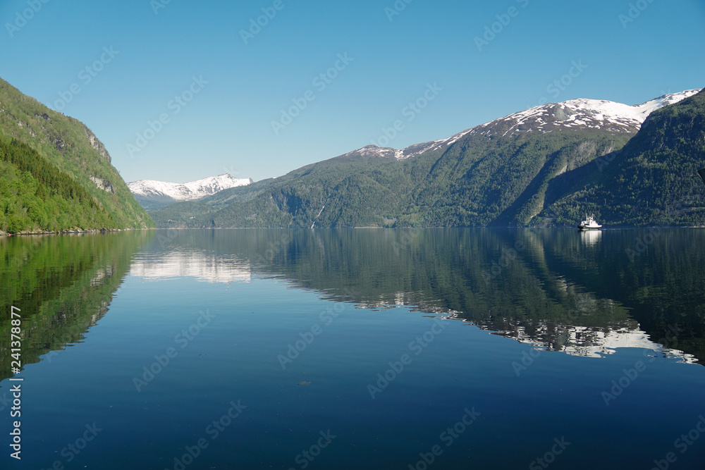 Norway beautiful spring landscape. Mountains reflection in calm water of fjord Norway beautiful spring landscape. Mountains reflection in calm water of fjord