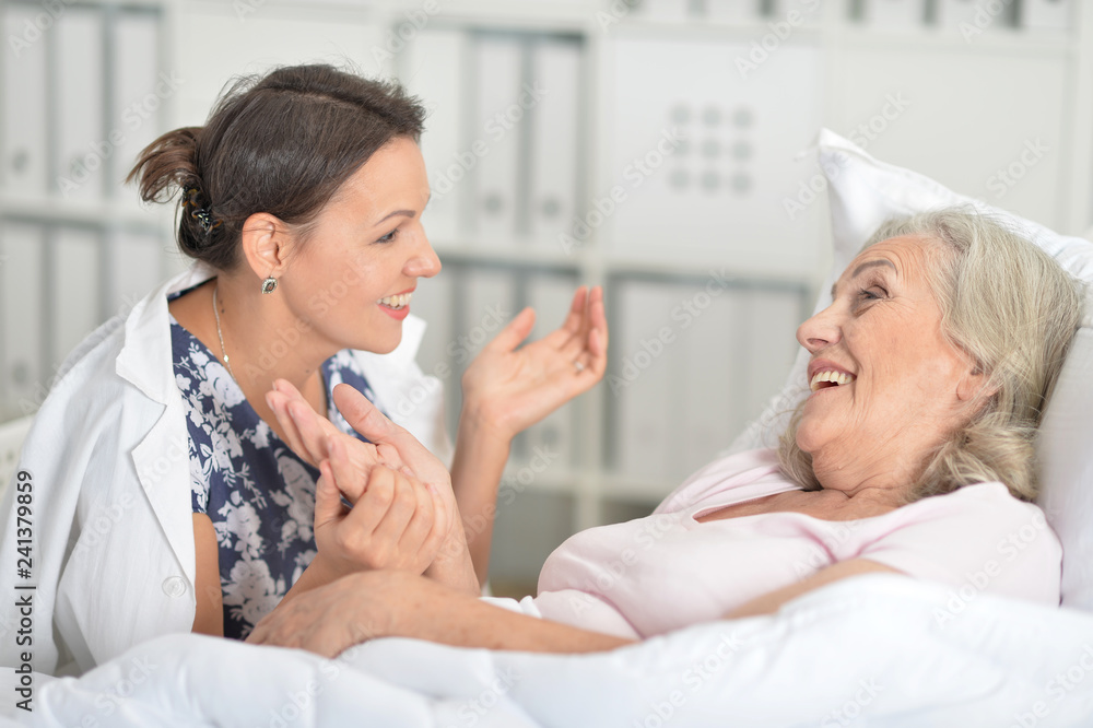 Close up portrait of young woman visiting sick mother Close up portrait of young woman visiting sick mother
