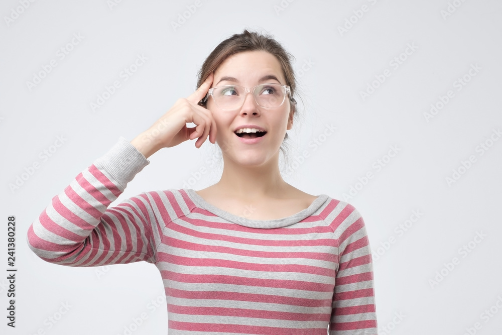Portrait of a beautiful young woman wearing glasses thinking Portrait of a beautiful young woman wearing glasses thinking
