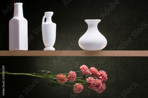 Fototapeta Still life with white vases and a flower branch