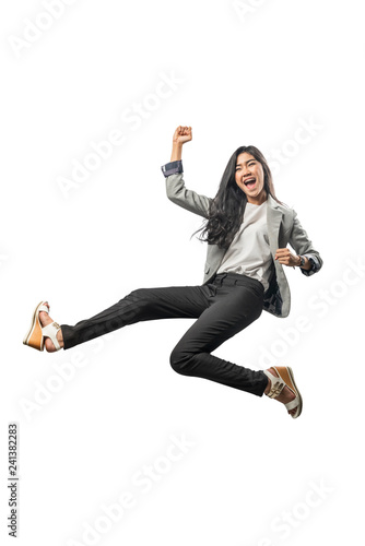 Successful asian business woman jumping and raised arm to the air