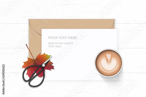Flat lay top view elegant white composition letter paper kraft envelope coffee autumn maple leaf and vintage metal scissors on wooden background