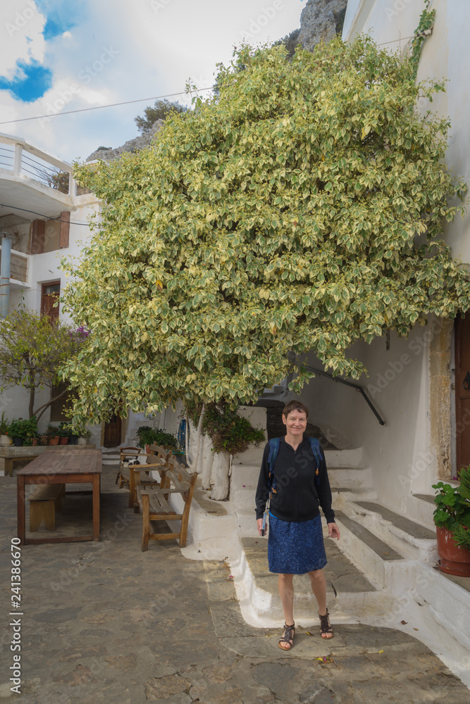 Agios Nikolaos, Crete - 09 29 2018: My girl in Moni Faneromenis monastery