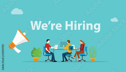 we are hiring recruitment concept with megaphone and team employee working together at office