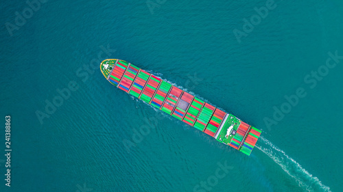 Container ship carrying container for import and export, business logistic and freight transportation by ship in open sea. © Kalyakan