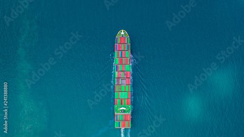 Container ship carrying container for import and export, business logistic and freight transportation by ship in open sea.
