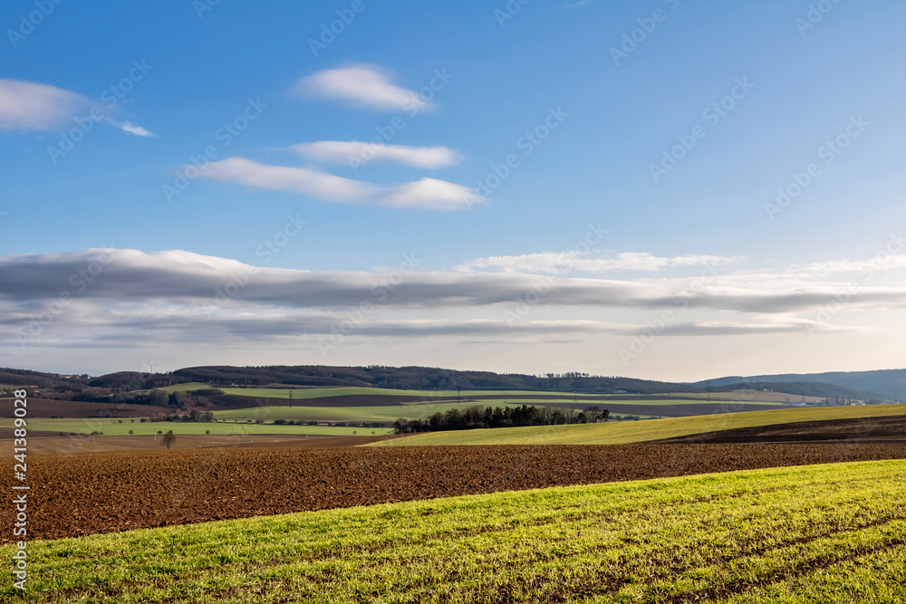 Amazing fall countryside with fields, forests and blue sky