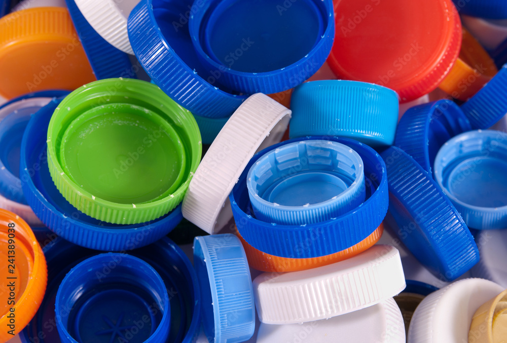 Plastic bottle caps as a background. Close up image Plastic bottle caps as a background. Close up image