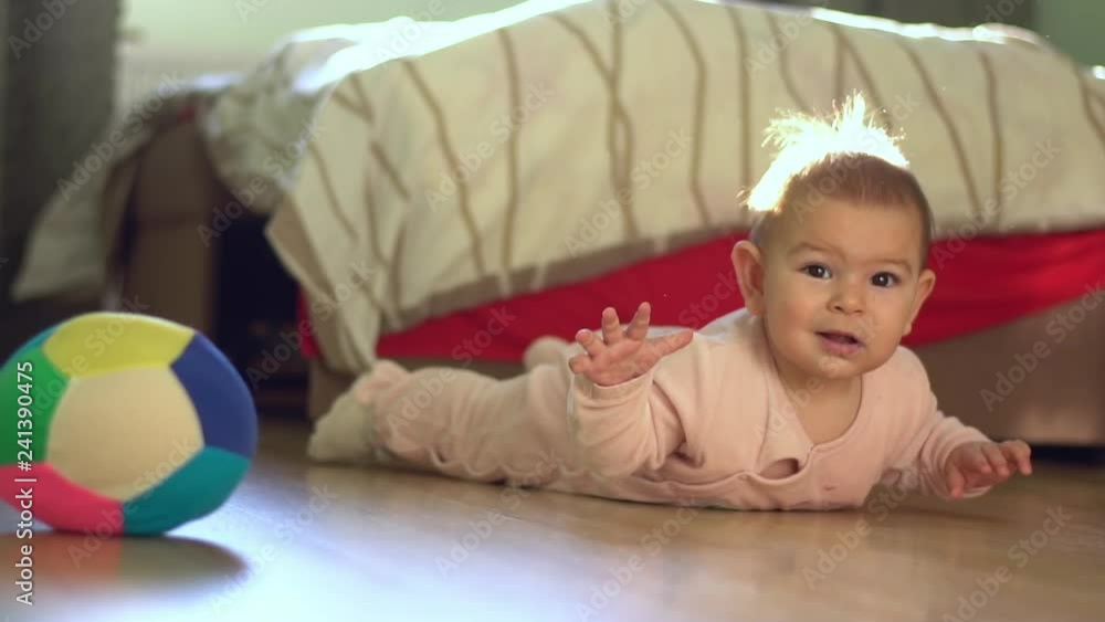 Baby Playing on Floor During Tummy Time learn crawl ball development activities Baby Playing on Floor During Tummy Time learn crawl ball development activities