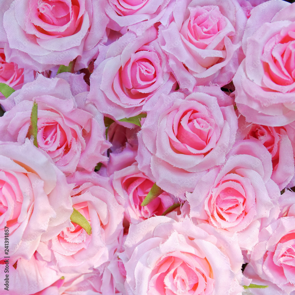 pink fake roses closeup, colorful background pink fake roses closeup, colorful background