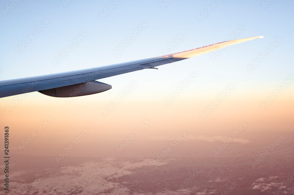 Airplane Wing over Hazy Red Landscape Airplane Wing over Hazy Red Landscape