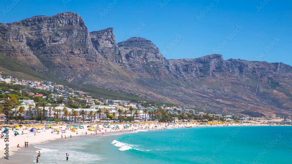 View Camps bay beautiful beach with turquoise water and mountains in Cape Town, South Africa