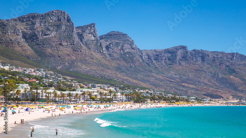 View Camps bay beautiful beach with turquoise water and mountains in Cape Town, South Africa photo
