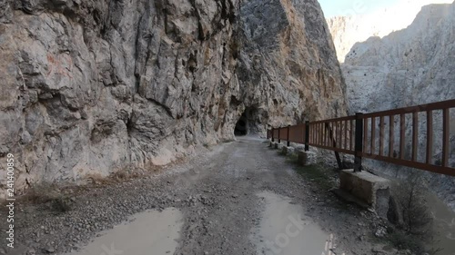 Dark Canyon of Kemaliye with stone road and tunnels, river Euphrates running through, Erzincan, Turkey photo