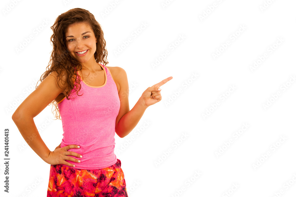 active young fit woman point into copy space as presenting an product isolated over white active young fit woman point into copy space as presenting an product isolated over white