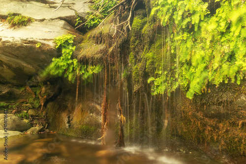 Fototapeta Naklejka Na Ścianę i Meble -  Beautiful summer destination at Pithara waterfalls in Andros island.