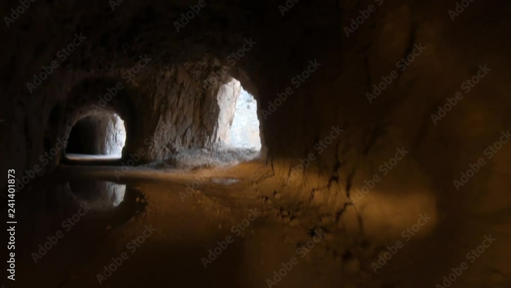 Dark Canyon of Kemaliye with stone road and tunnels, river Euphrates running through, Erzincan, Turkey Dark Canyon of Kemaliye with stone road and tunnels, river Euphrates running through, Erzincan, Turkey