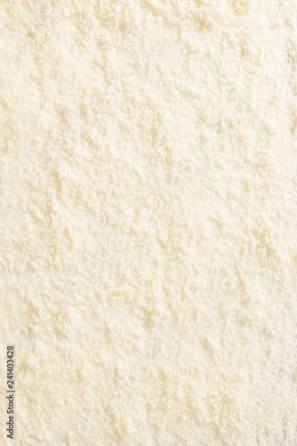 Grated parmesan cheese background from above.