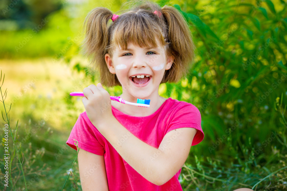 Happy little girl brushing her teeth. Dental hygiene. Healthy concept Happy little girl brushing her teeth. Dental hygiene. Healthy concept