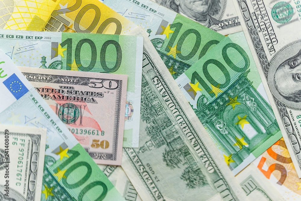 Background with american dollar and euro bills.